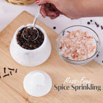 Mess-free spice sprinkling system with a marble container and glass bowl on a wooden surface.